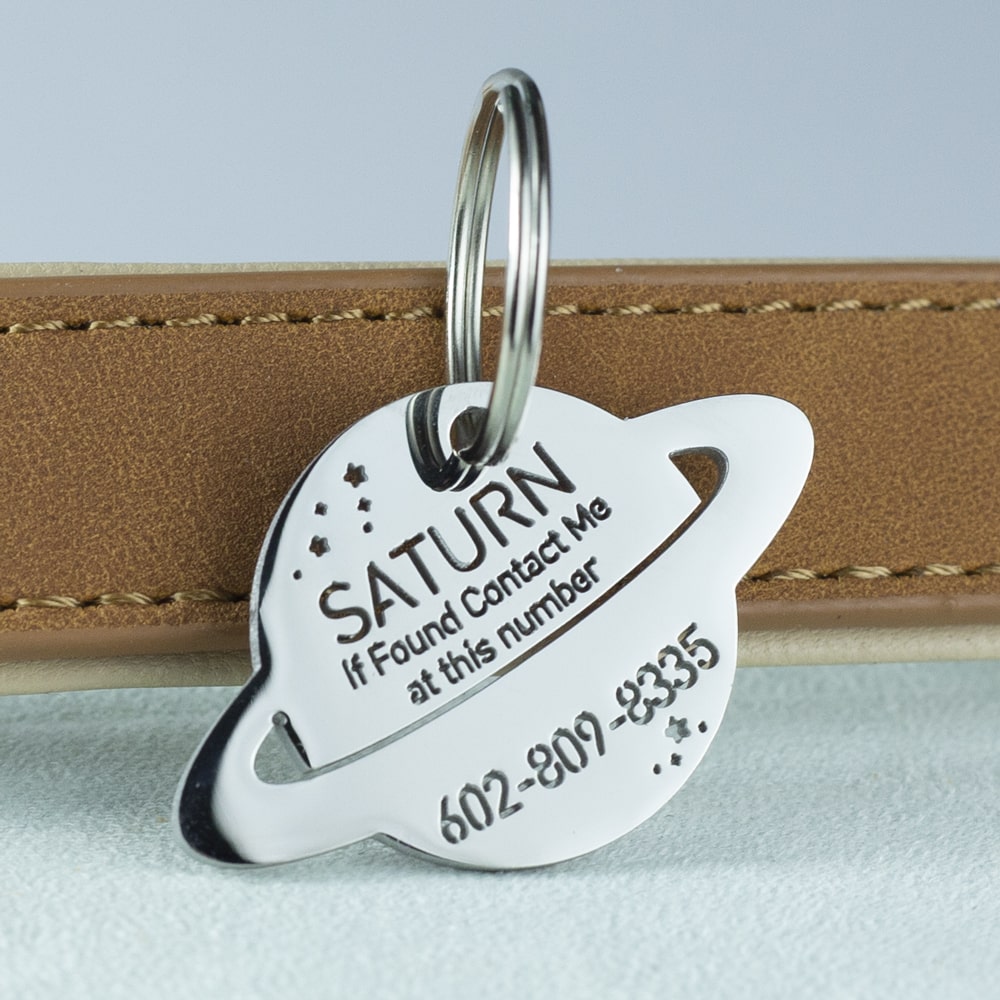 custom hollow laser-cut stainless steel saturn dog ID tag with cut-through name lettering