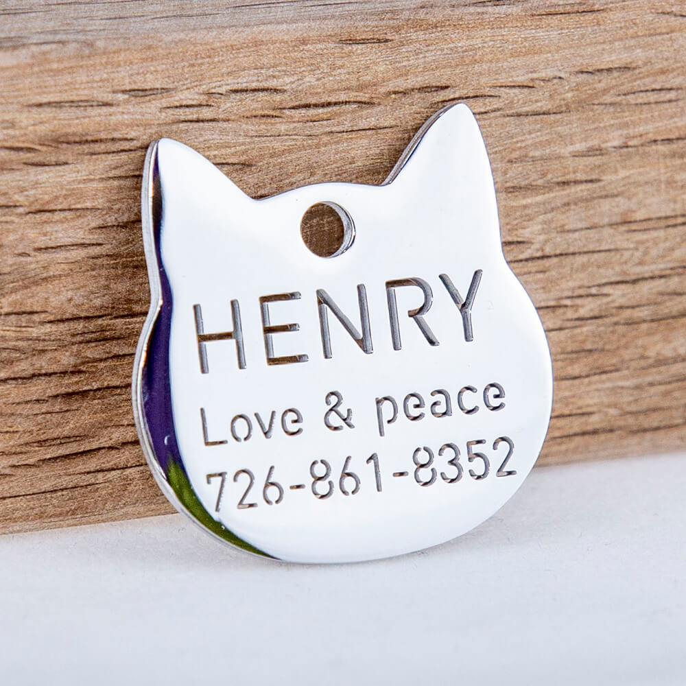 custom hollow laser-cut stainless steel hollow tags for cat with cut-through name lettering