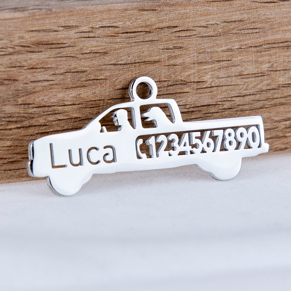 custom hollow laser-cut stainless steel pickup truck dog ID tag with cut-through name lettering