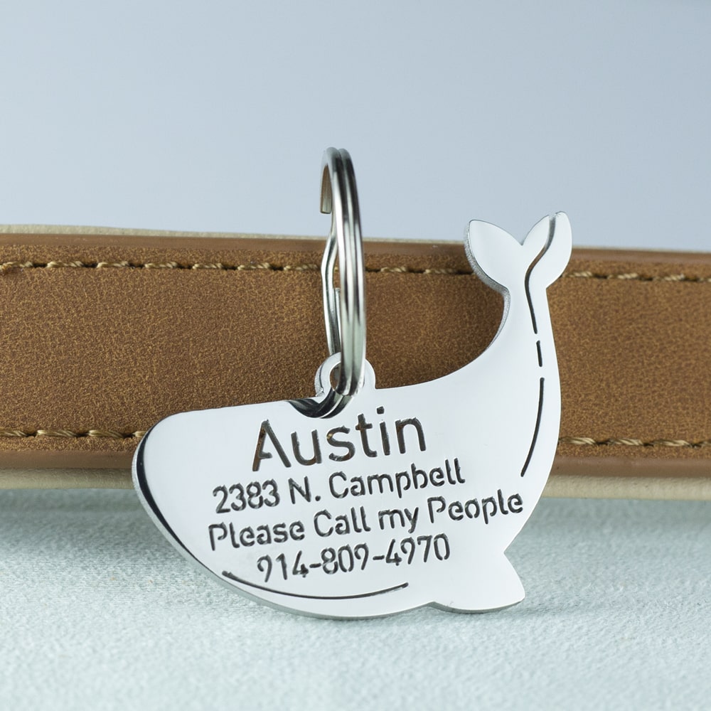 custom hollow laser-cut stainless steel blue whale dog ID tag with cut-through name lettering