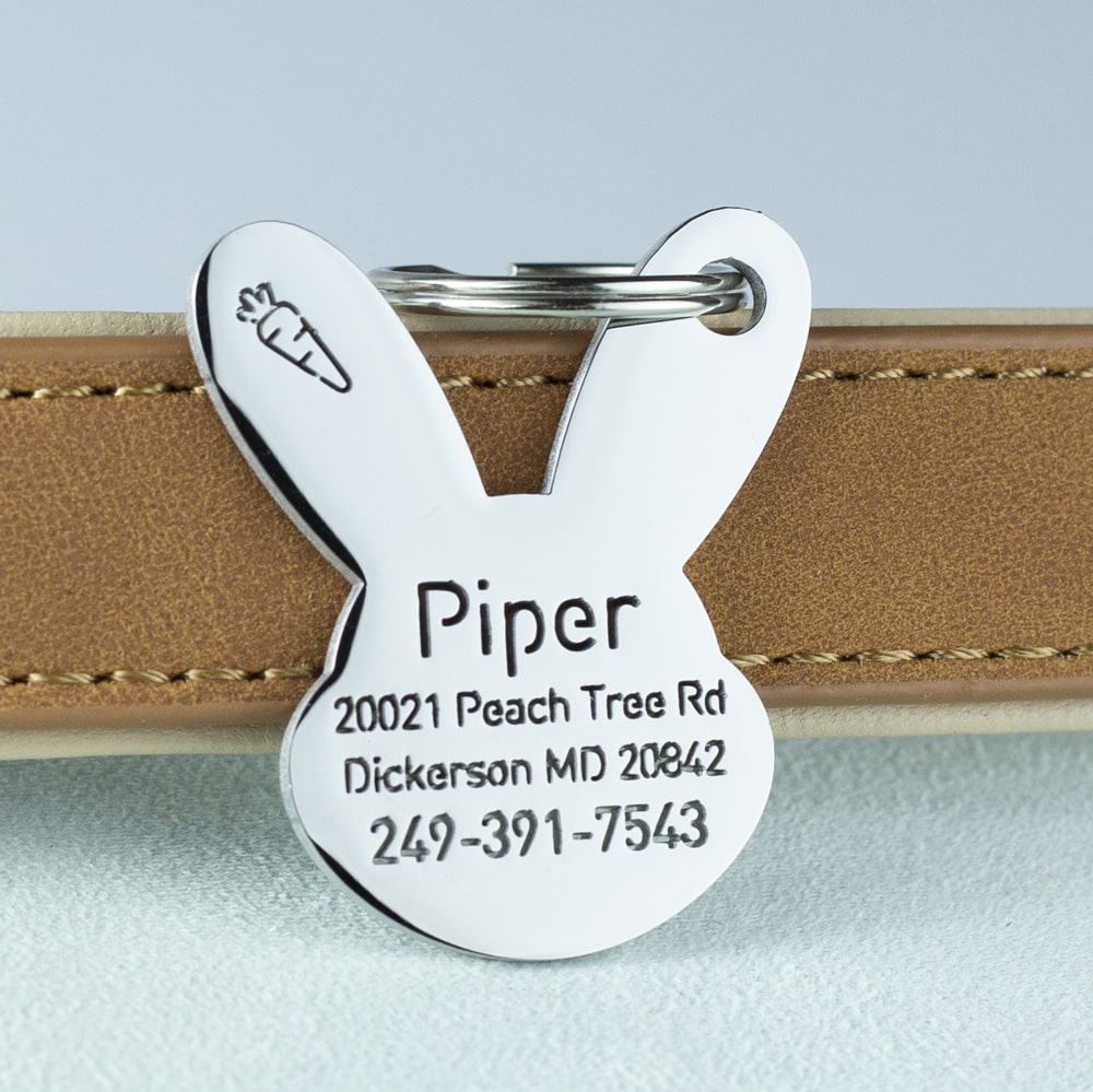 custom hollow laser-cut stainless steel bunny shaped dog ID tag with cut-through name lettering