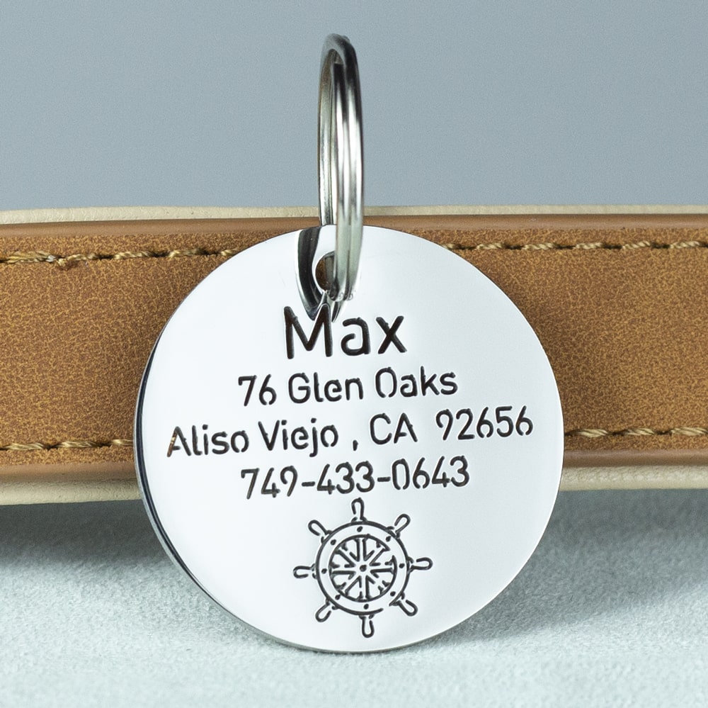 custom hollow laser-cut stainless steel round dog ID tag with rudder icon with cut-through name lettering