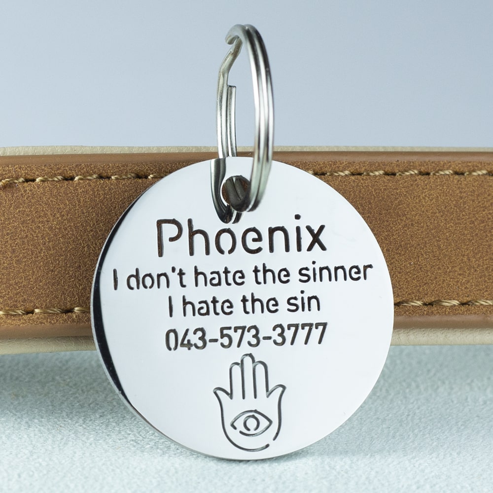 custom hollow laser-cut stainless steel hamsa dog ID tag with cut-through name lettering
