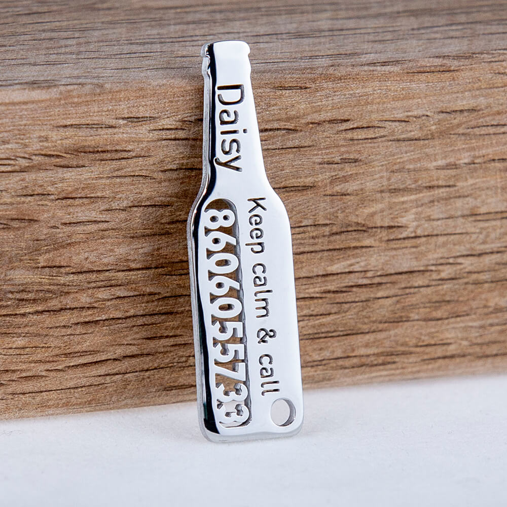 custom hollow laser-cut stainless steel beer bottle dog ID tag with cut-through name lettering