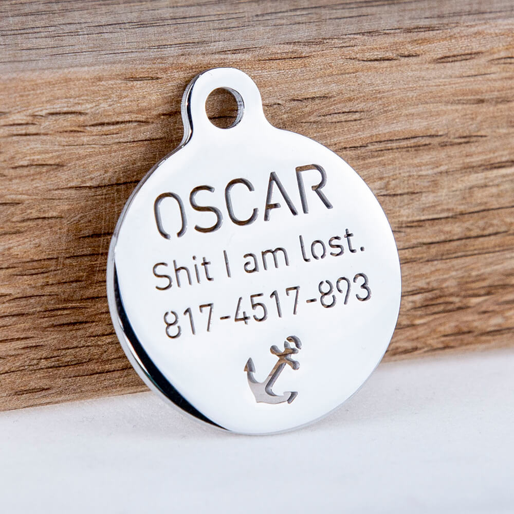 custom hollow laser-cut stainless steel small round dog ID tag with cut-through name lettering